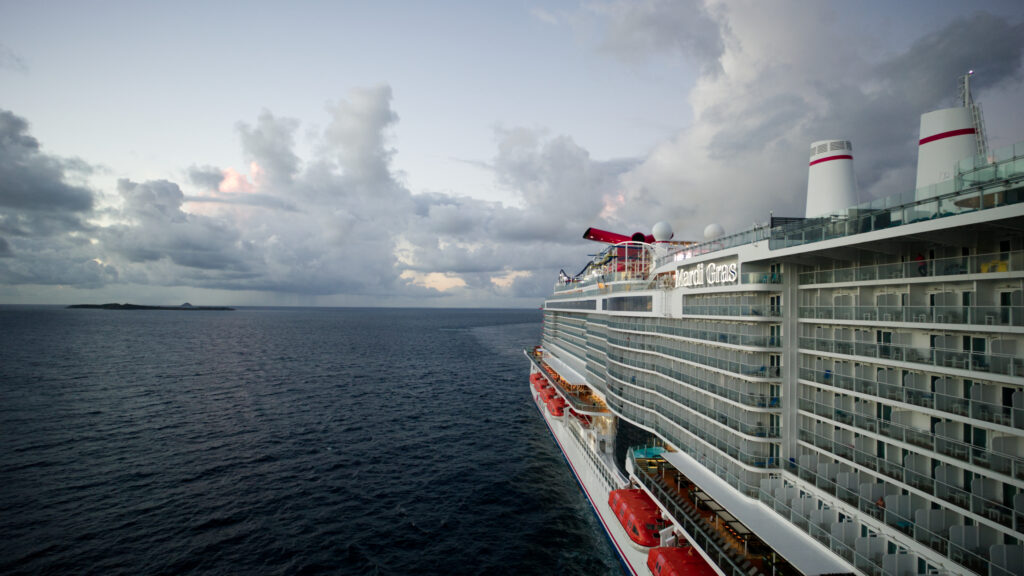 Guests enjoying a vibrant event aboard a Carnival Cruise Line ship.